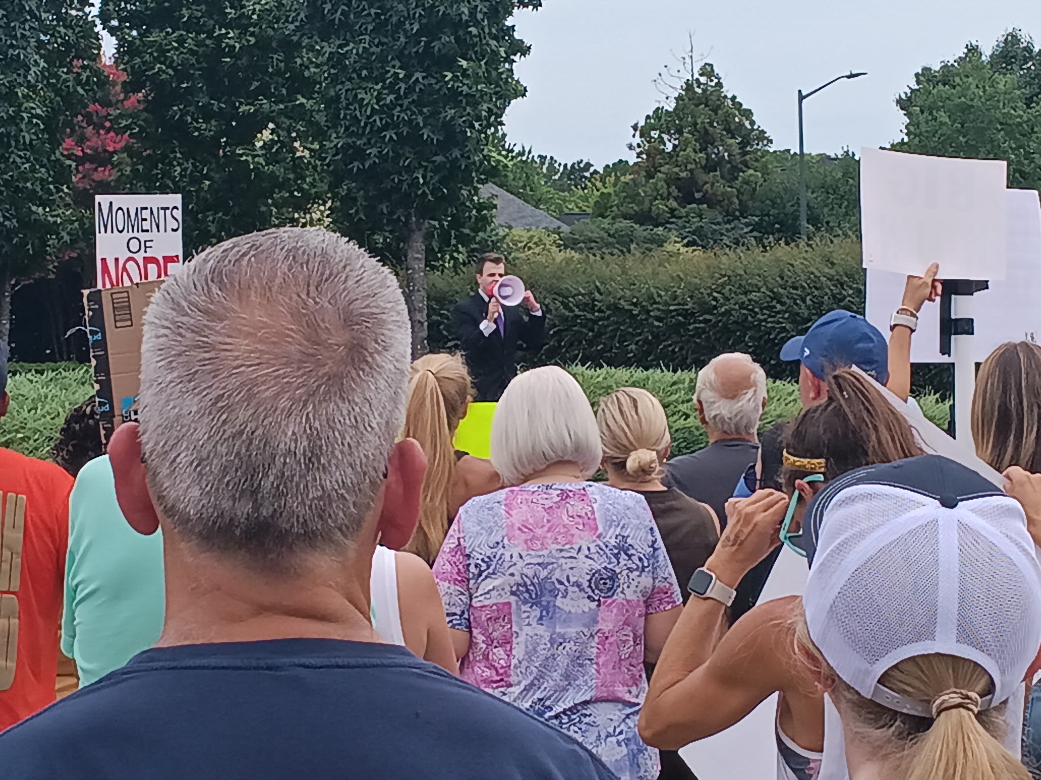 Charlotte public speaker and community organizer JD Hopper addressing a large crowd
