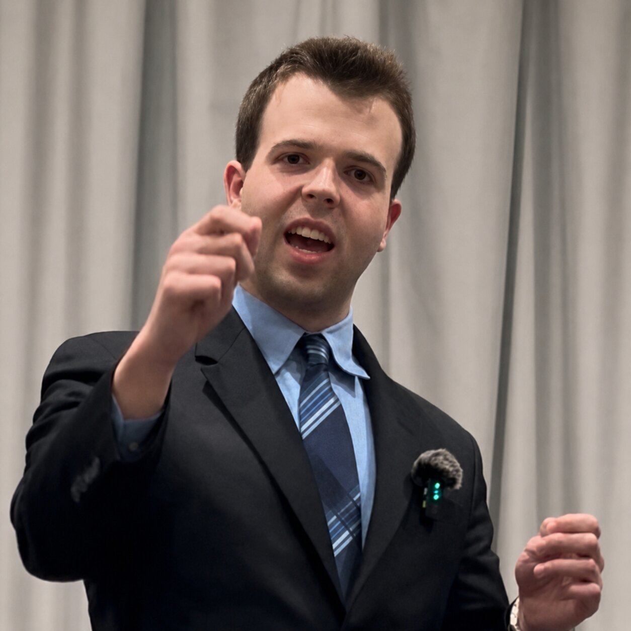 JD Hopper public speaker in Charlotte presenting with expressive hand gesture